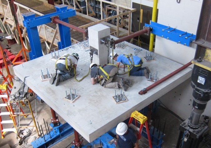 construction workers on cement block