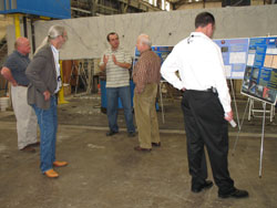 group looking at presentation boards